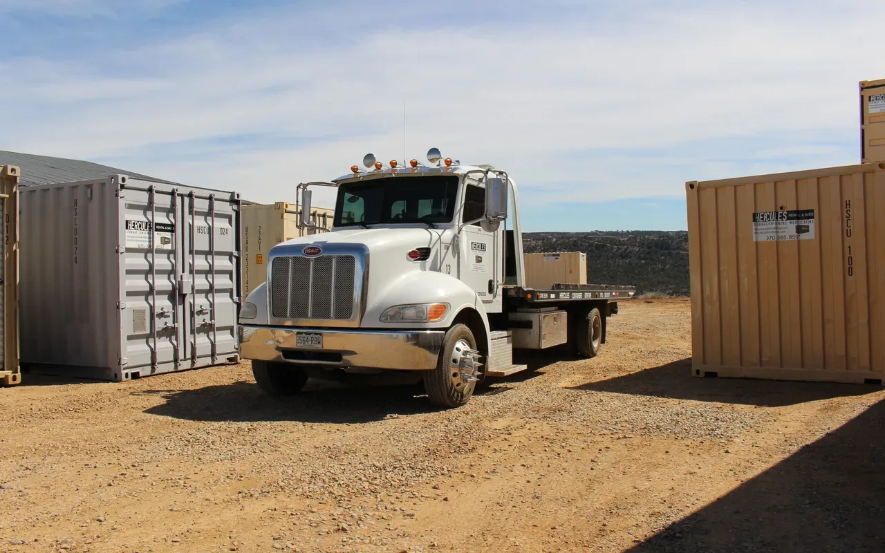Container transport on delivery truck